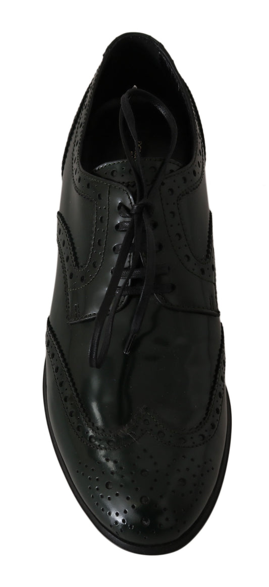 Black leather dress shoe with laces and small dots on upper part