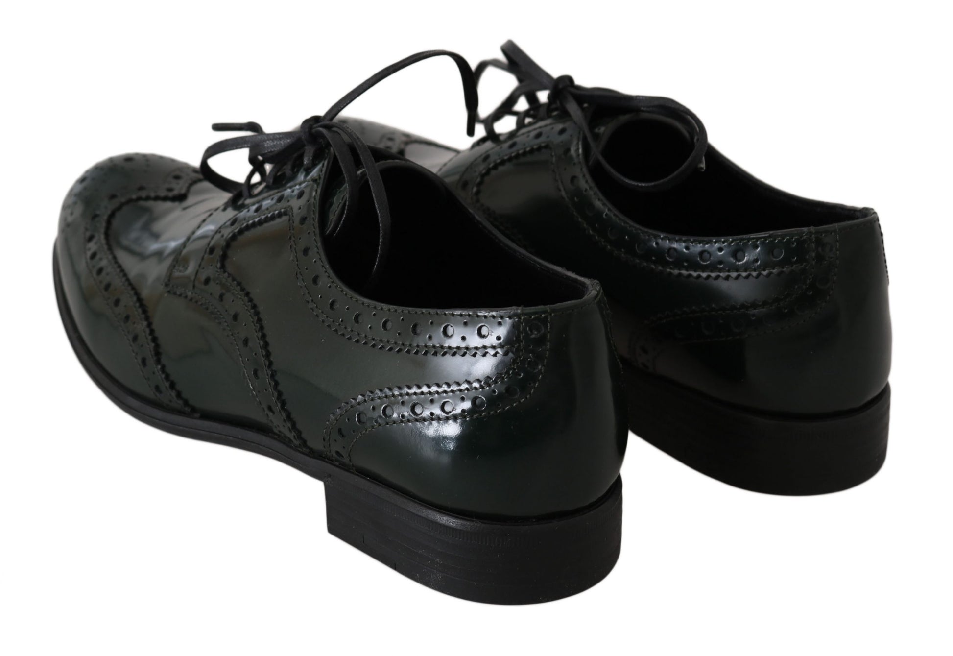 Pair of black dress shoes with laces and a small heel