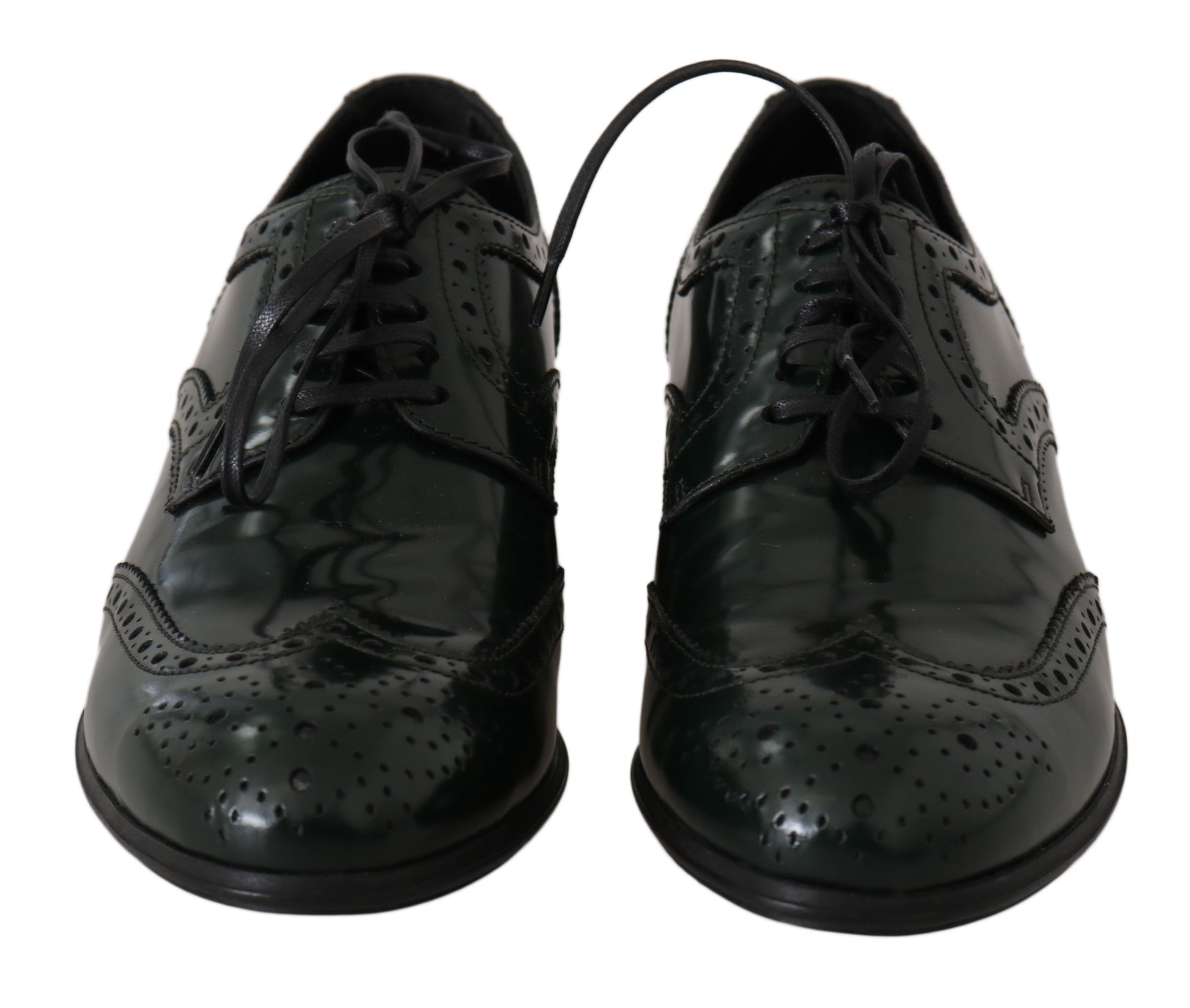 Pair of black dress shoes with laces and a bow tie