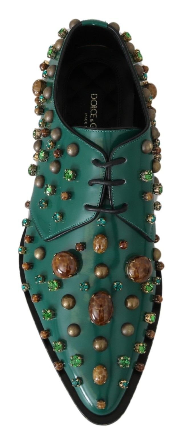 Green shoe with brown and green stones on top