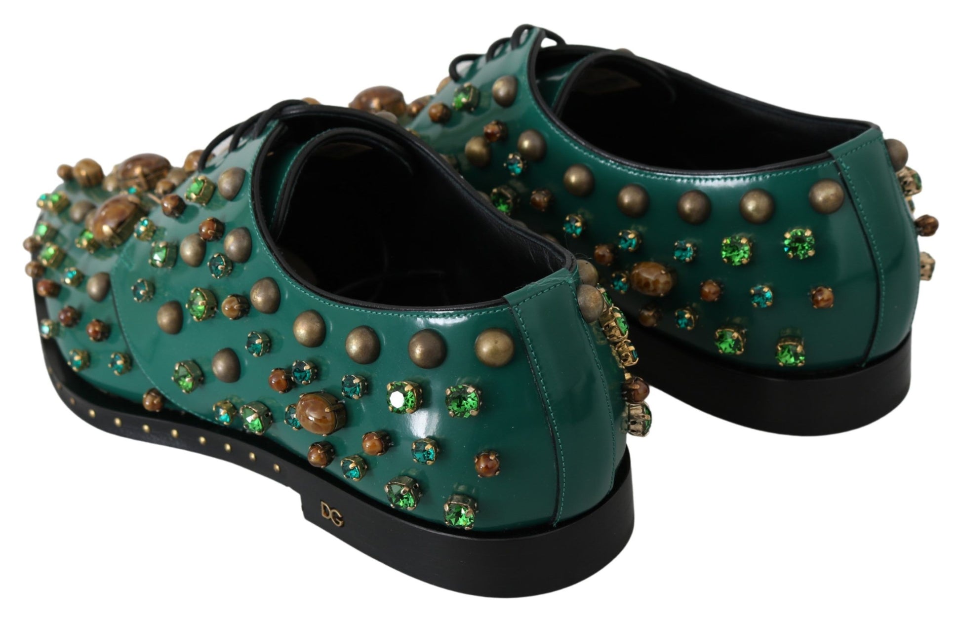 Pair of green shoes with gold accents and studs