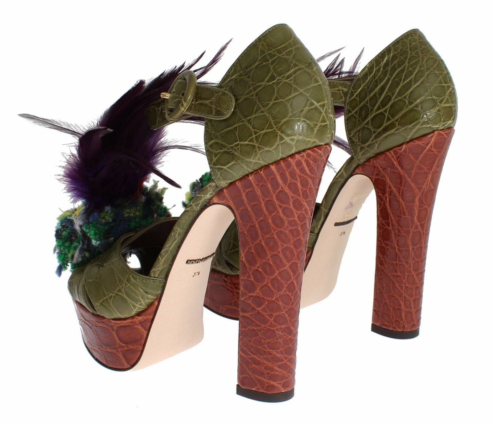 High heel shoes with a reptile print and feathers on top