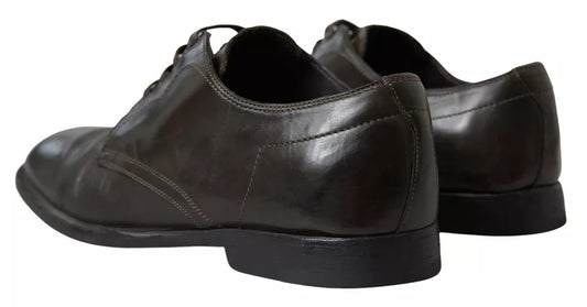 Pair of brown leather men's dress shoes with laces and a small heel