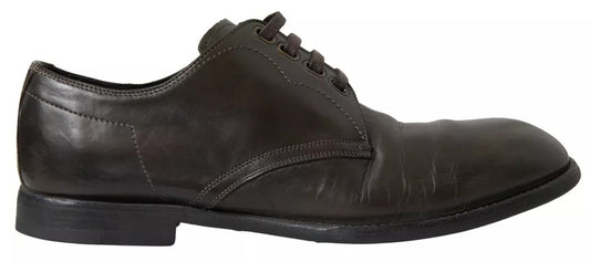 Pair of black leather men's dress shoes with laces and a small heel
