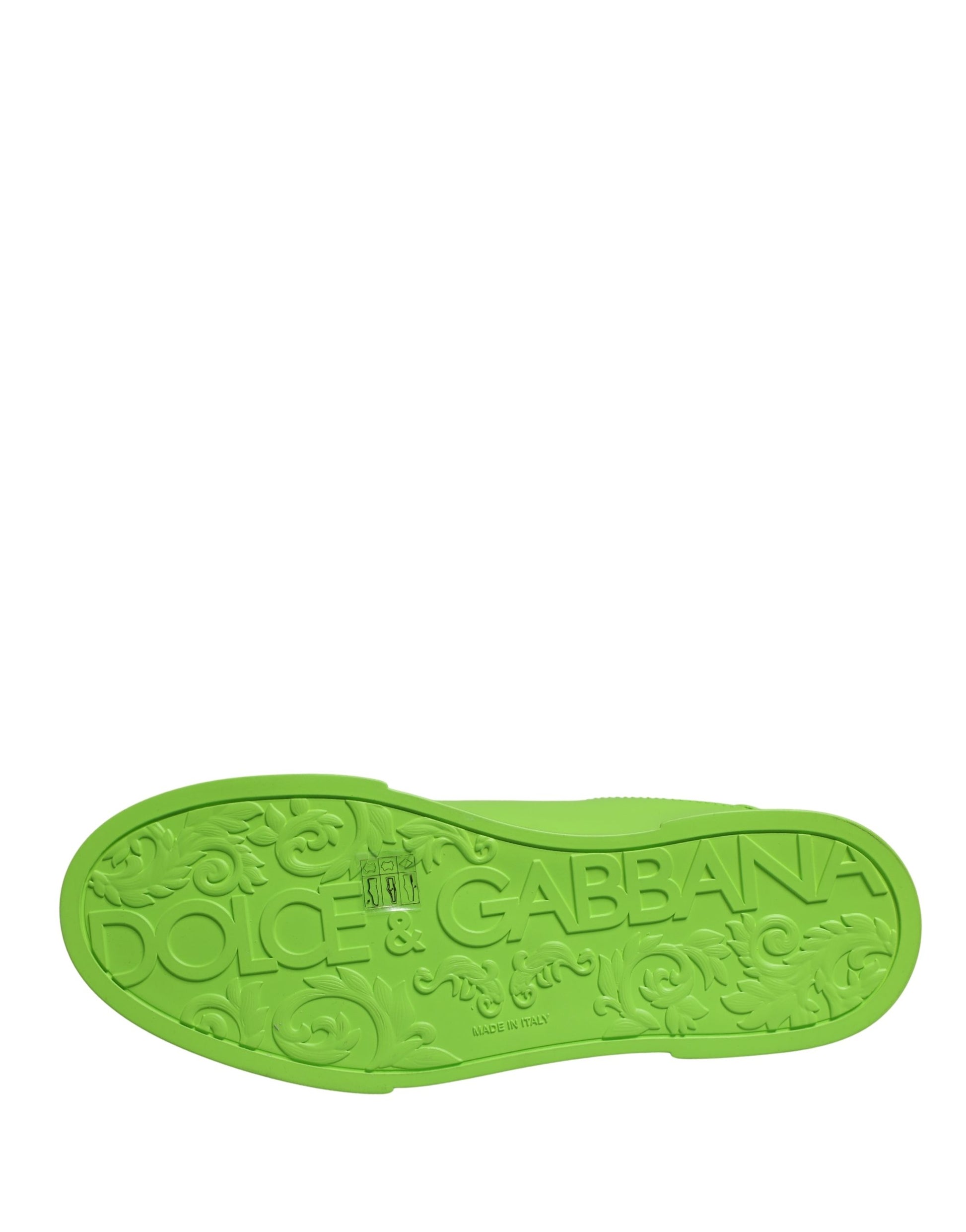 A green leather shoe with a distinctive design and the brand name "Dolce & Gabbana" visible on it