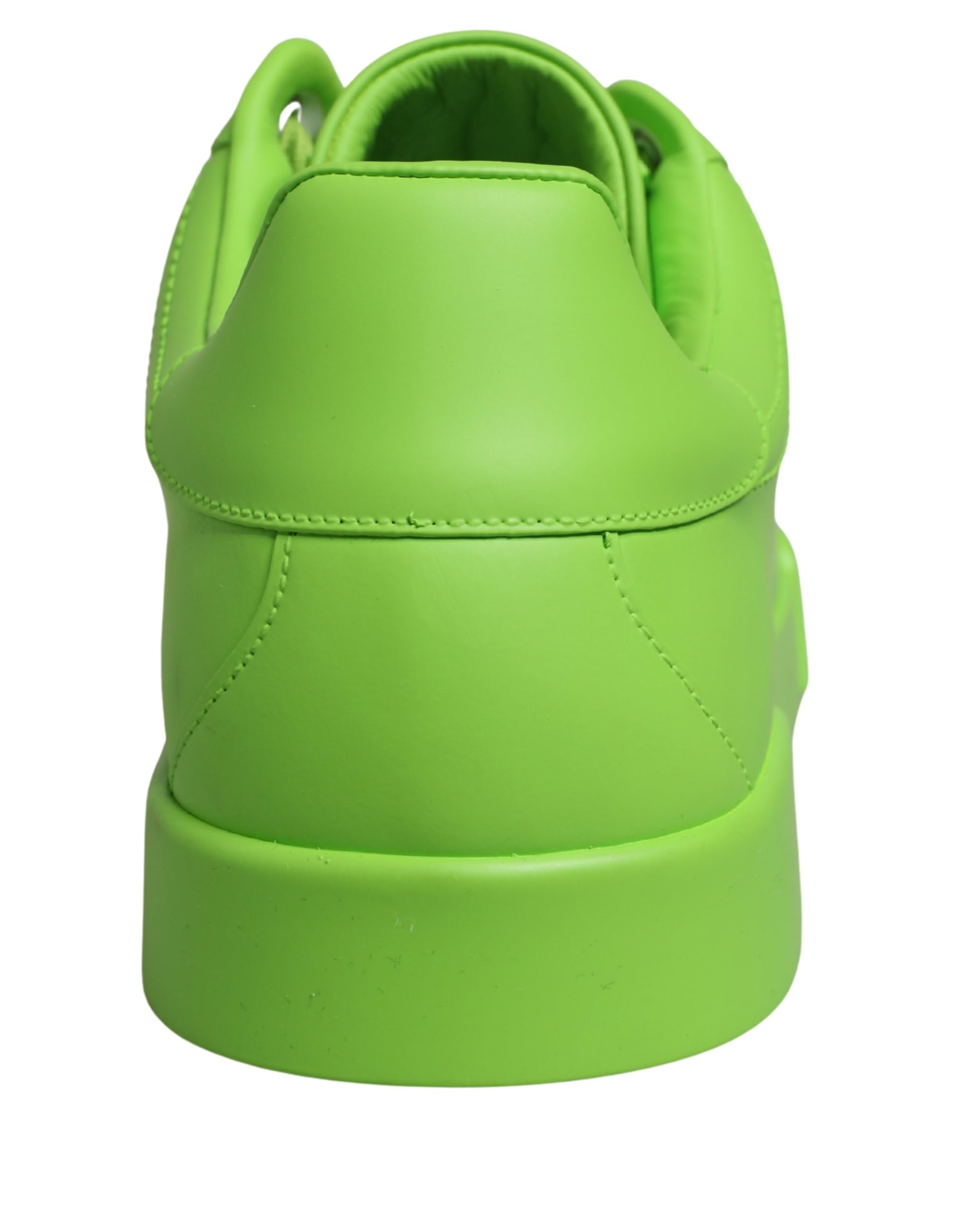 A pair of green leather sneakers with a low top, featuring the brand name "Dolce & Gabbana" on the side