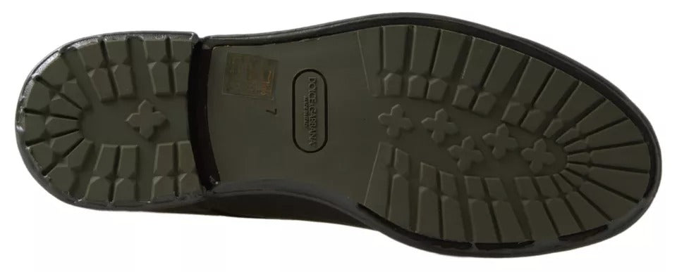 A pair of green leather dress shoes with rubber soles, featuring a lace-up design and a distinctive logo on the side