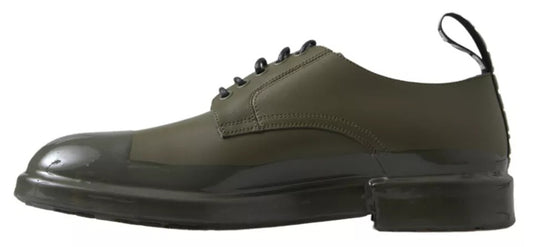 A pair of green leather dress shoes with rubber soles, featuring laces and a buckle closure