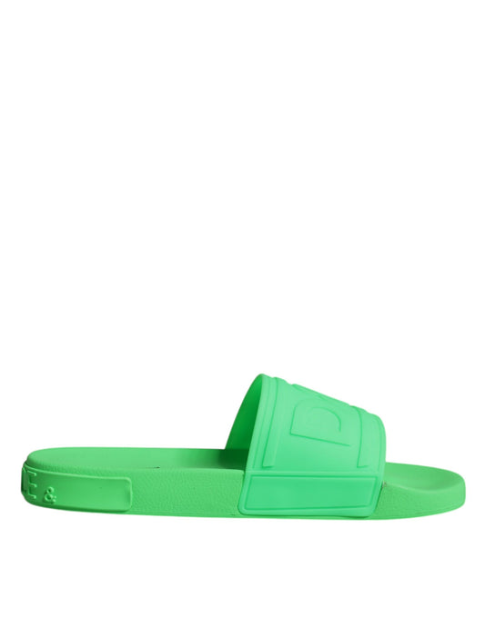 Green flip flops on white background