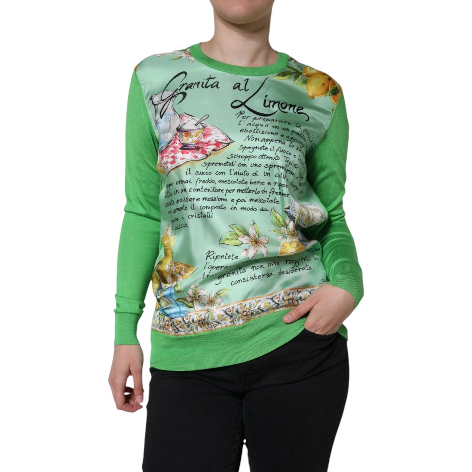 Long sleeve green sweater with floral design on front