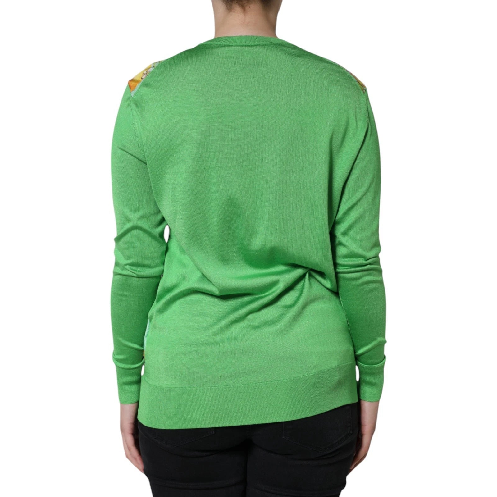 Green long sleeve shirt on a person's back