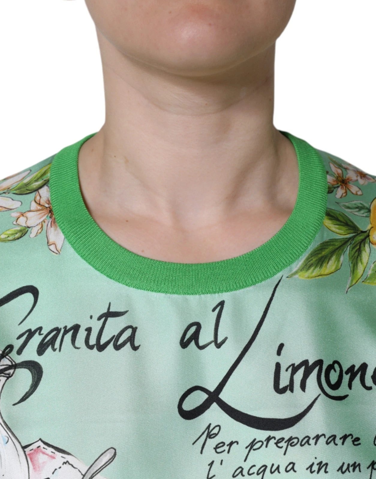 Green shirt with floral pattern on front