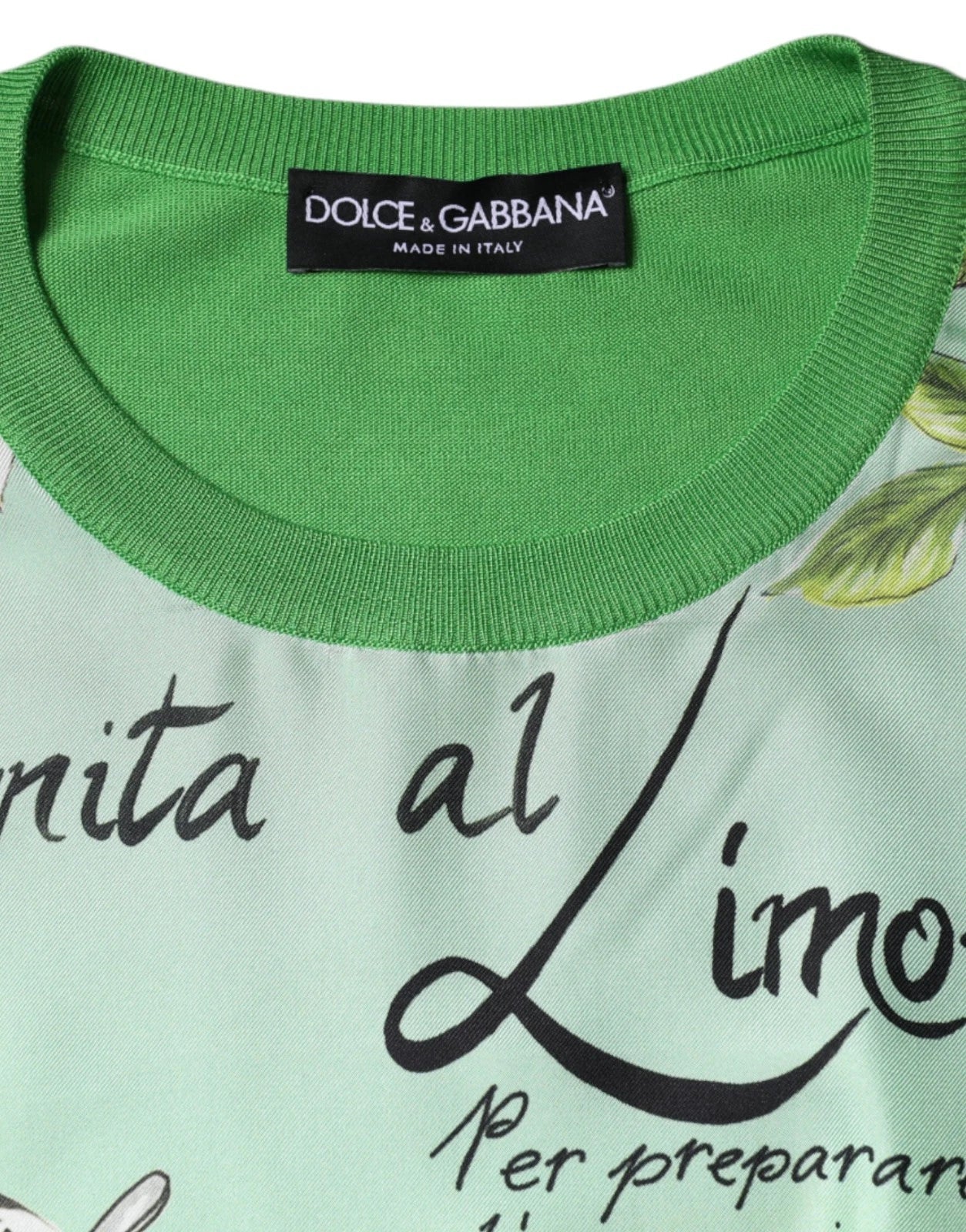 Green shirt with white writing