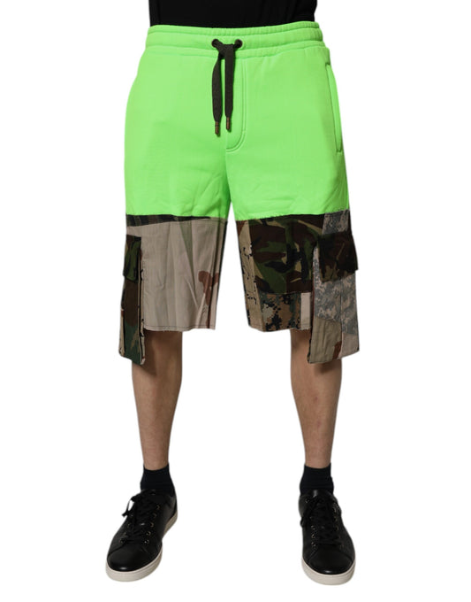 A pair of green camouflage cargo shorts with patchwork design, featuring a drawstring waistband