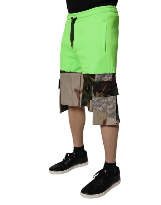 A pair of green camouflage cargo shorts with patchwork design