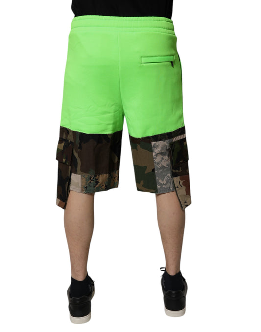 A pair of men's cargo shorts with a green patchwork camouflage pattern