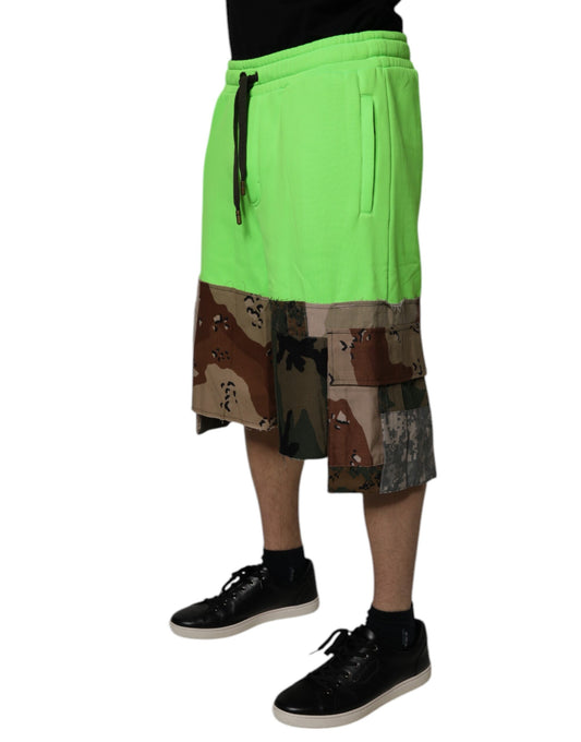 A pair of green patchwork cargo shorts with multiple patterns and textures, designed by Dolce & Gabbana