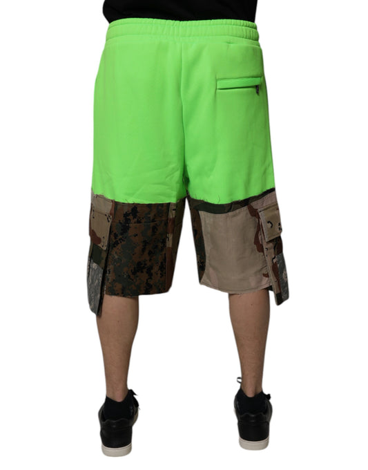A pair of green cargo shorts with patchwork design and black accents, featuring a side pocket