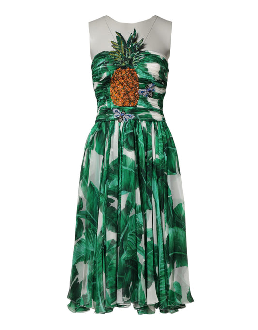 A green dress with pineapples and banana leaves embellishment, designed by Dolce & Gabbana