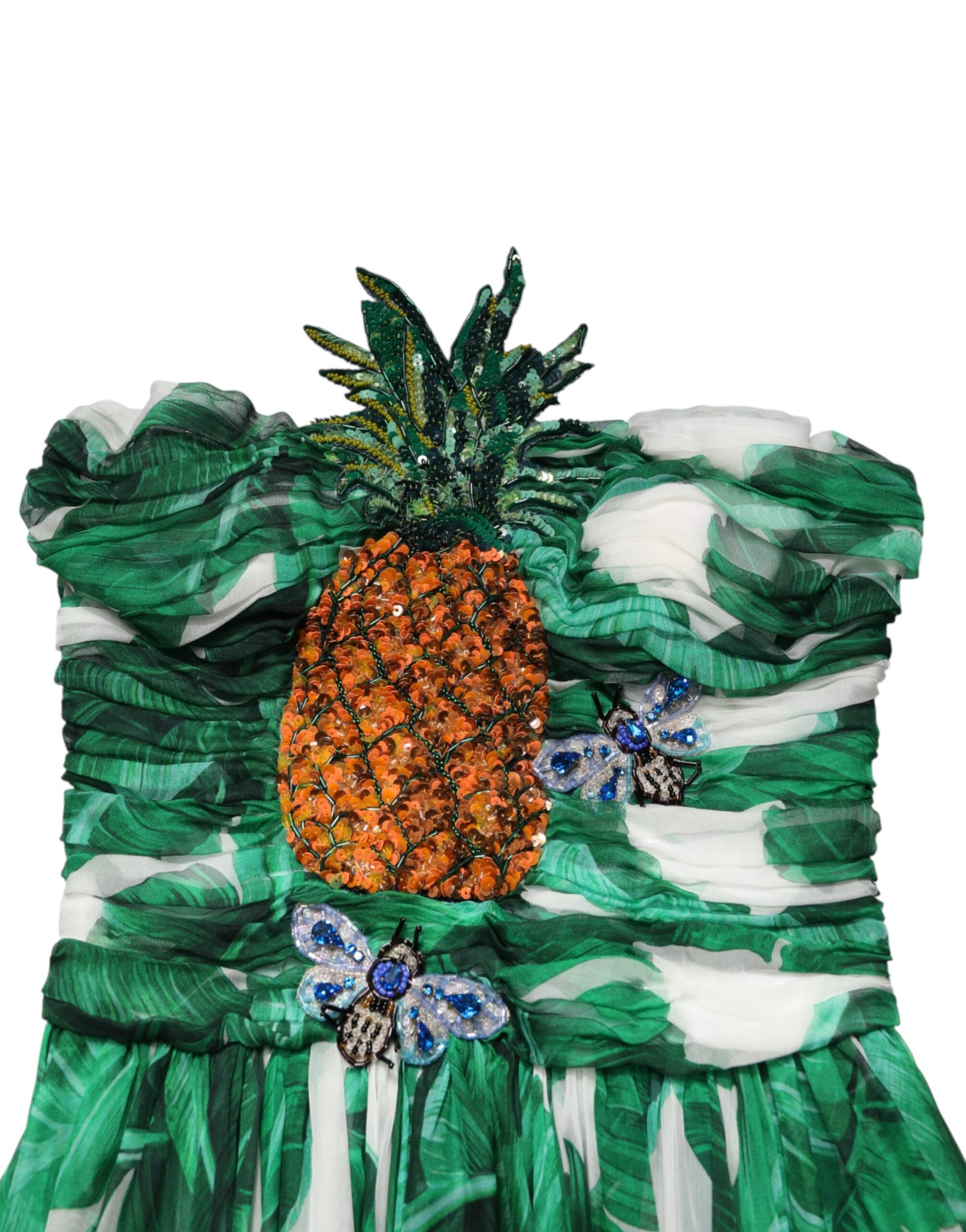 A green pineapple embellished banana leaf dress with a ruffled neckline and sleeves