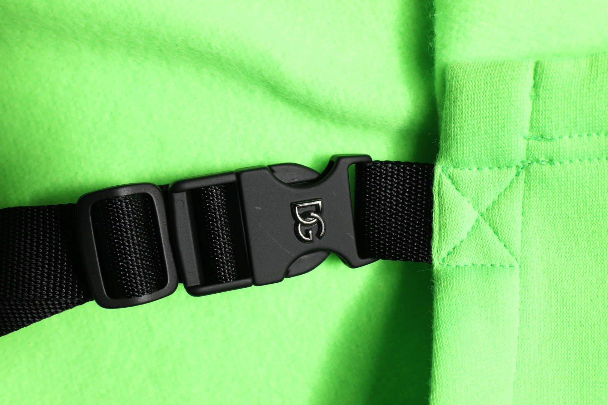 Black buckle on a green strap