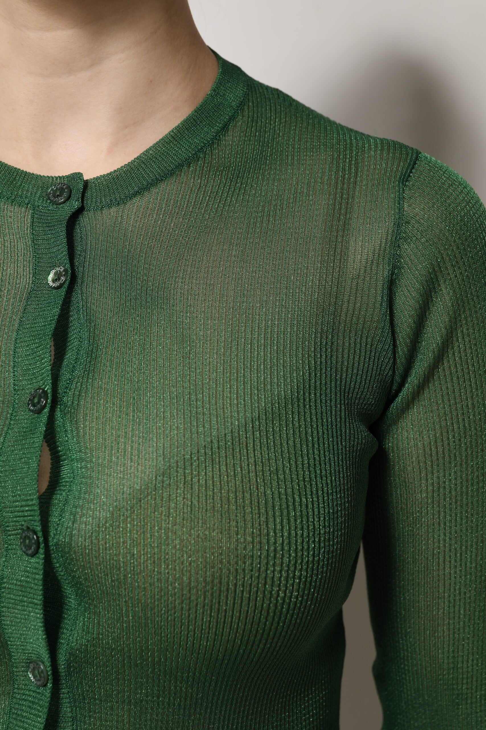 Green knitted sweater with buttons