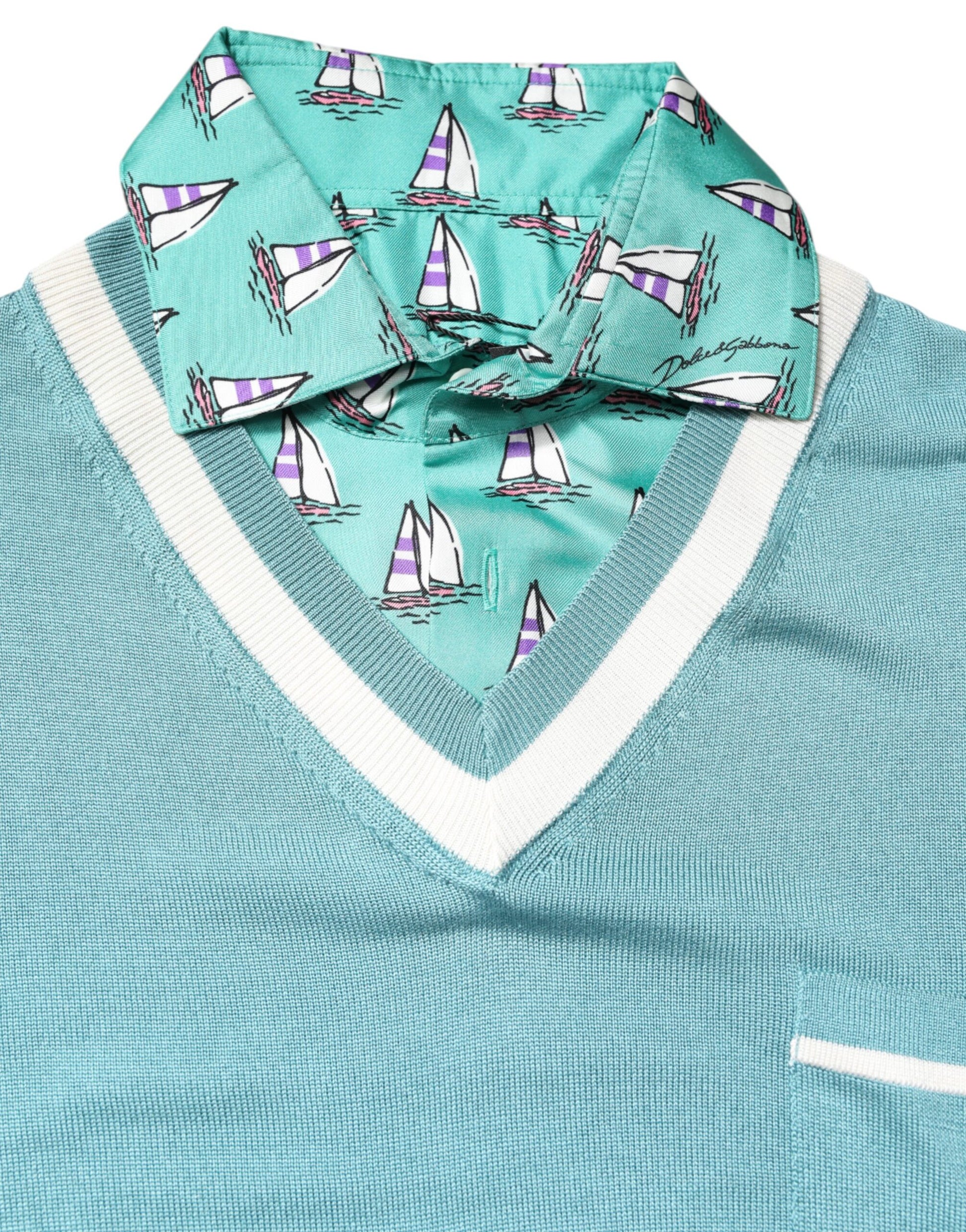 Blue sweater vest with sailboat patterned scarf