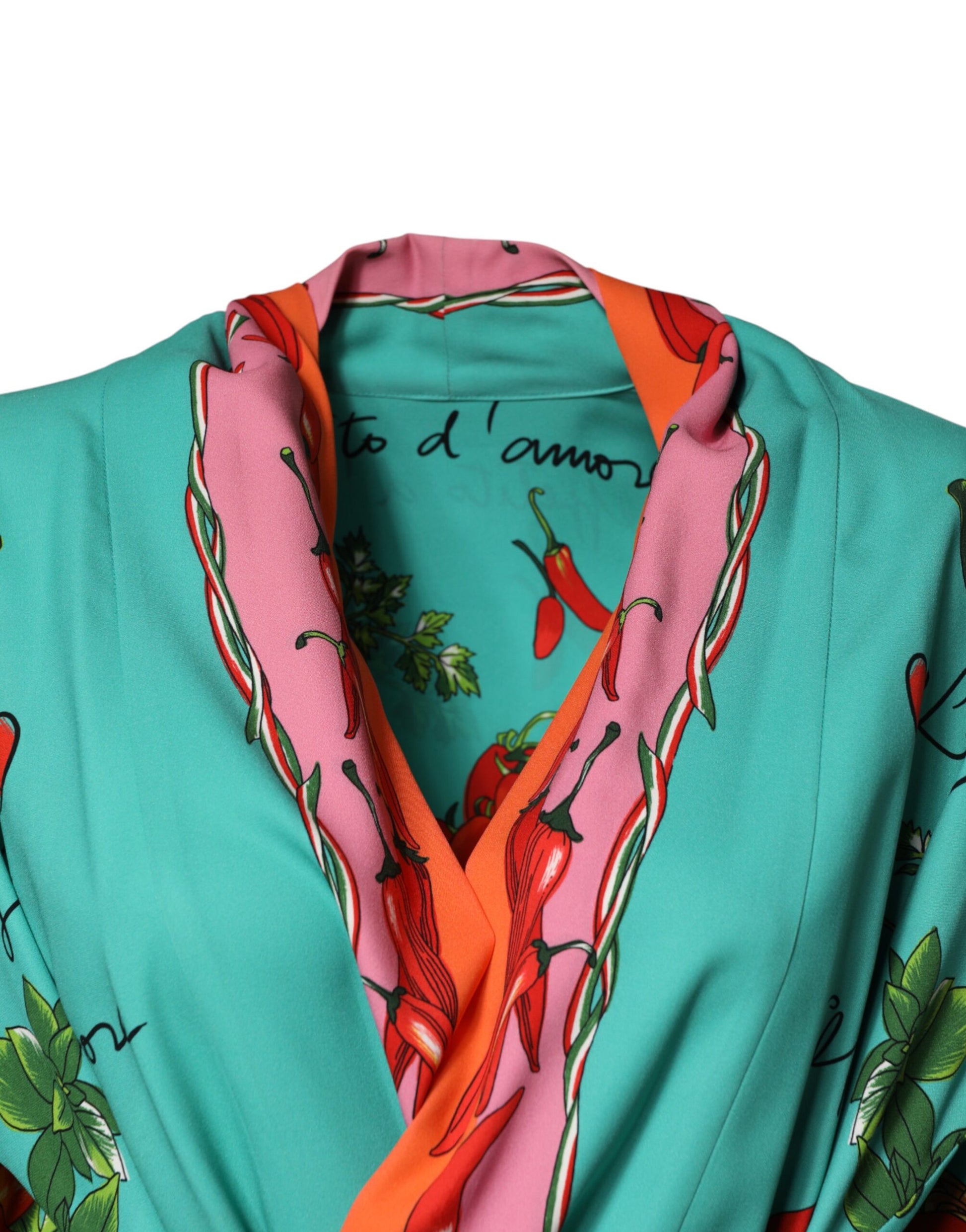A green printed long sleeve wrap coat dress with pink and red accents