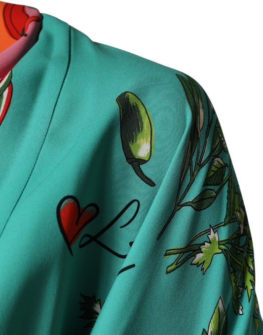 A green printed long sleeve wrap coat dress with a bird design on the shoulder