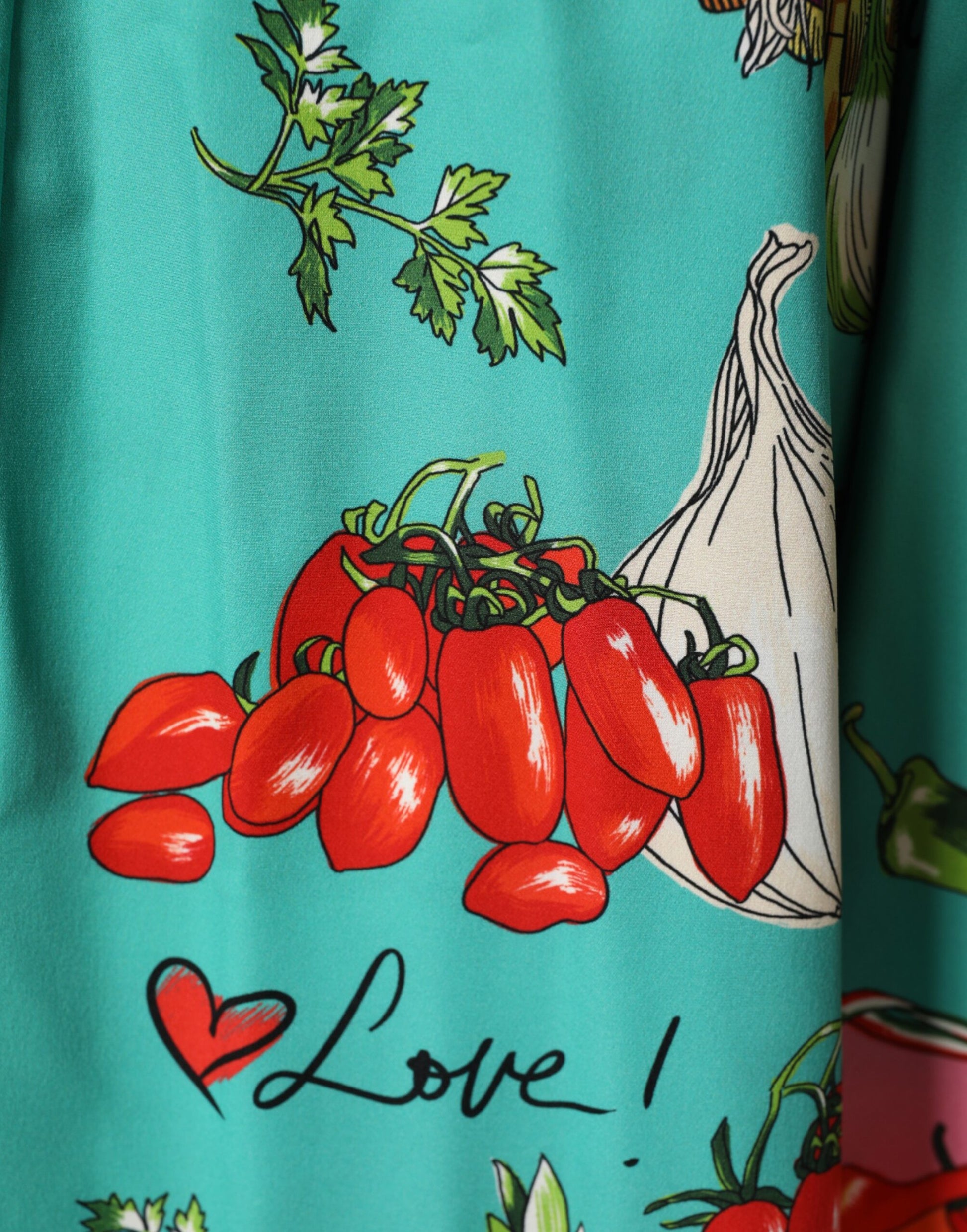 A green printed long sleeve wrap coat dress with red peppers and garlic