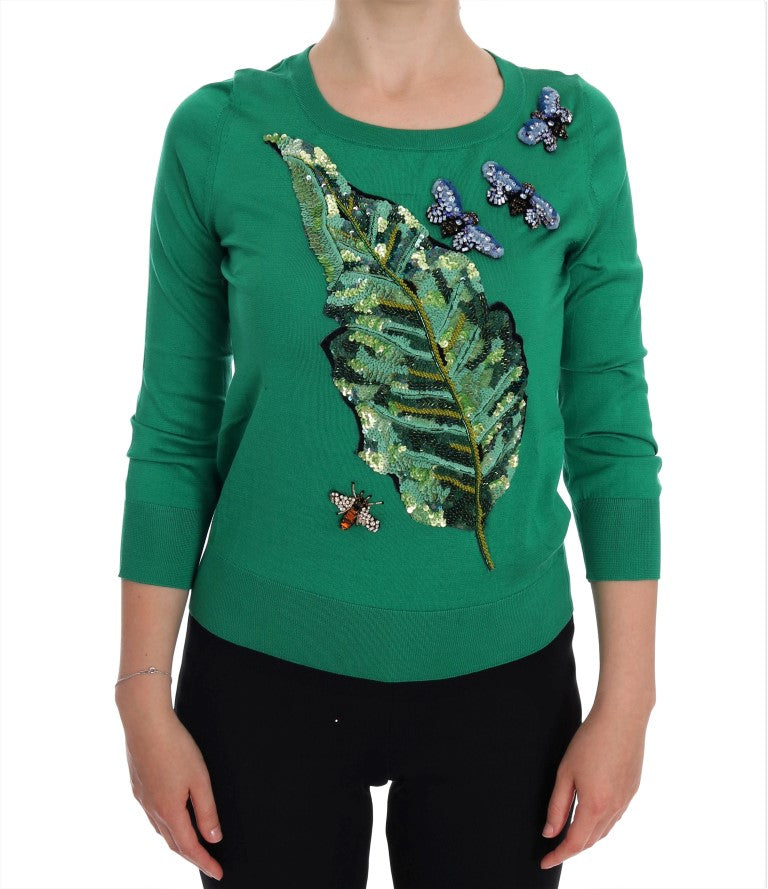 Green sweater with leaf design and butterflies