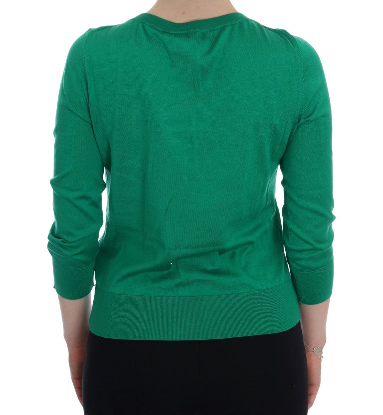 Green long sleeve sweater on back of person