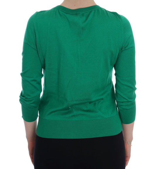 Green long sleeve sweater on back of person