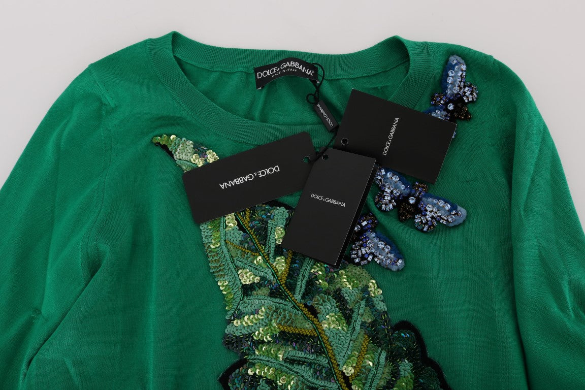Green sweater with butterfly design on front