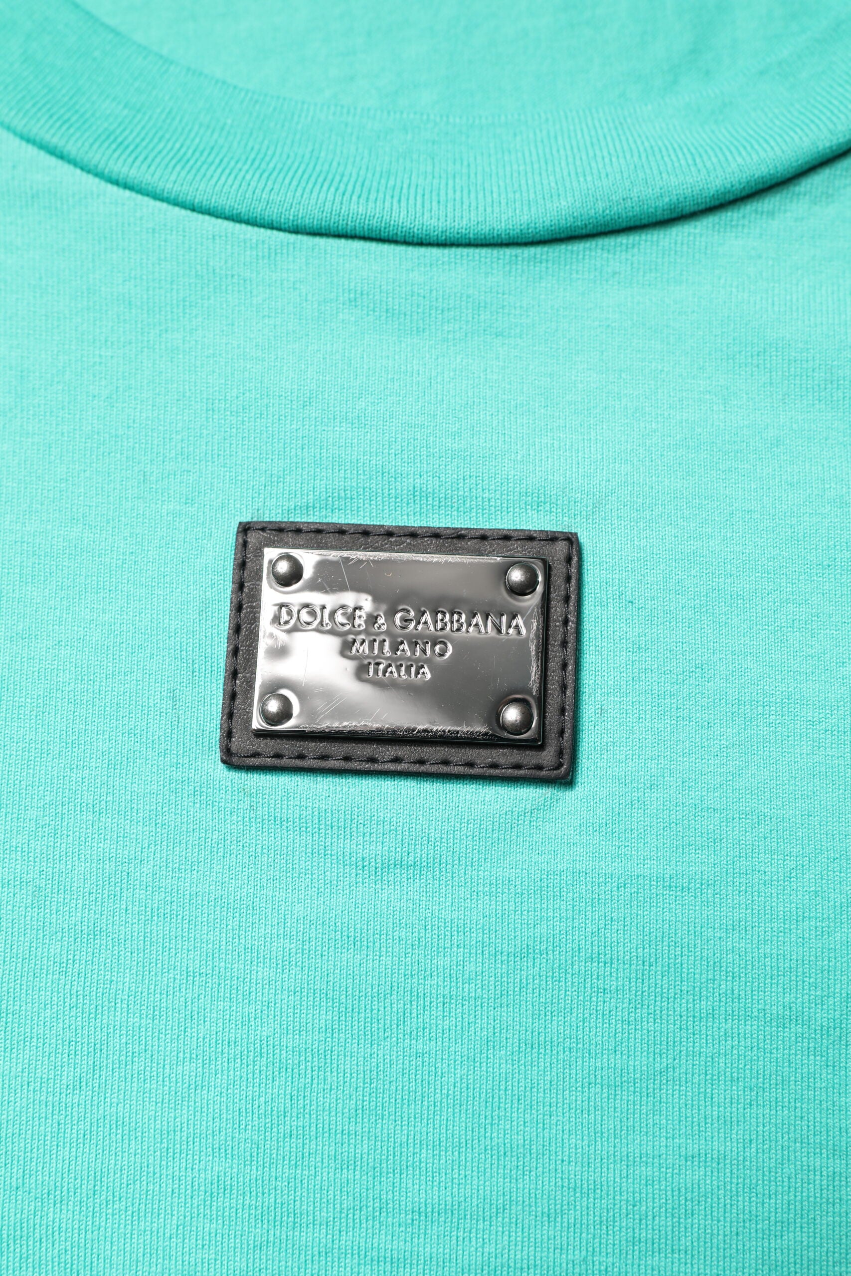 Green sweater with brand label on front