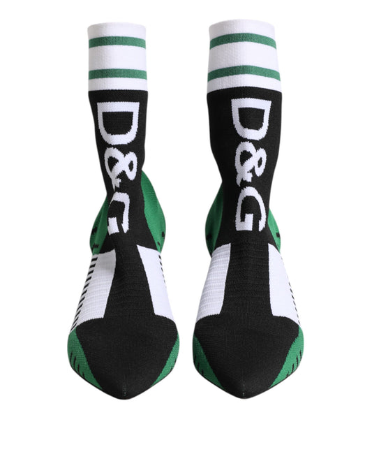 Pair of black socks with green stripes and white lettering