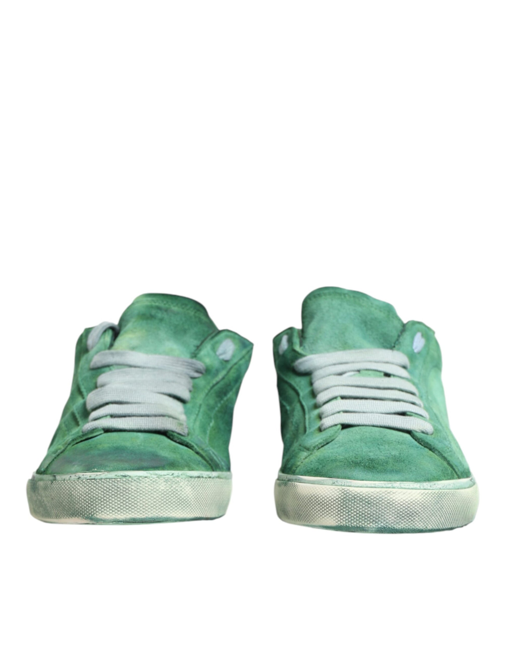 Pair of green sneakers with white laces