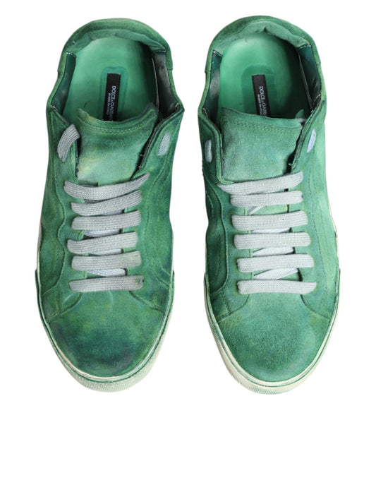Pair of green sneakers with white laces