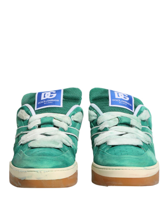 Pair of green sneakers with white laces