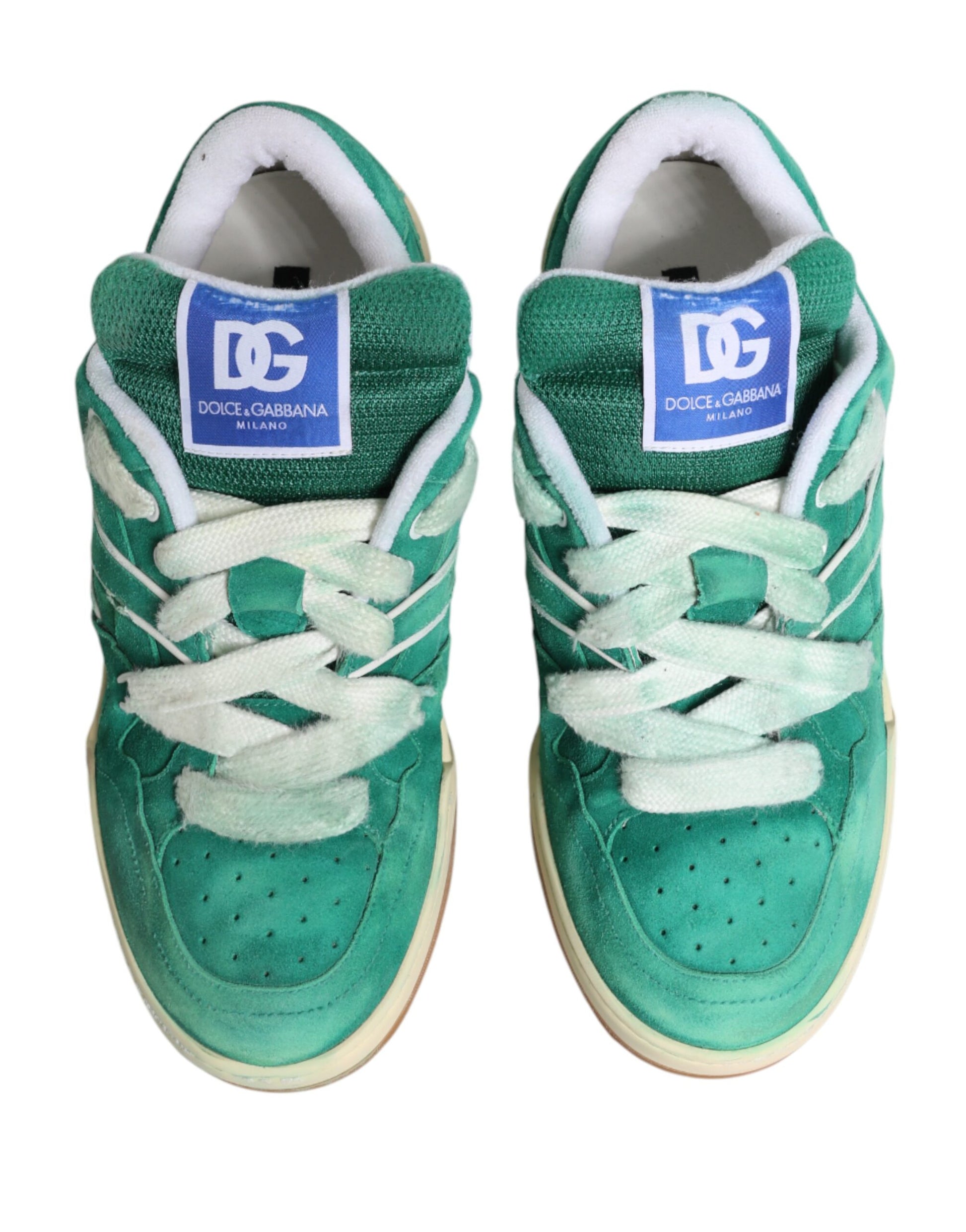 Pair of green sneakers with white laces and a blue logo on the side
