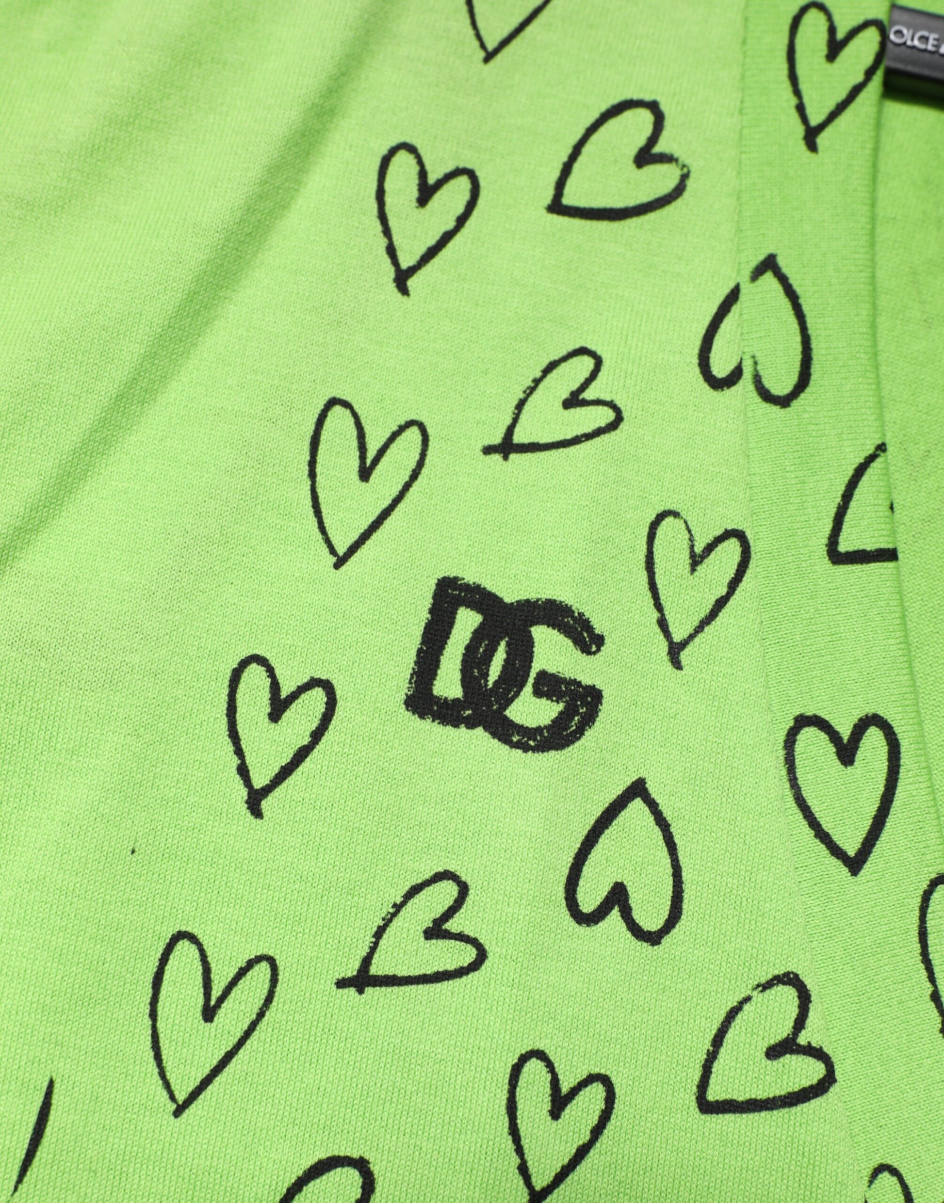 Neon green socks with hearts and a logo in the center
