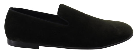 Pair of black loafers with a pointed toe and elastic panels on sides