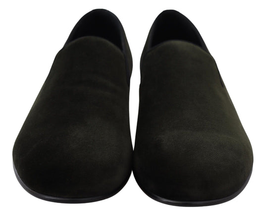 Pair of dark green slippers with a smooth texture