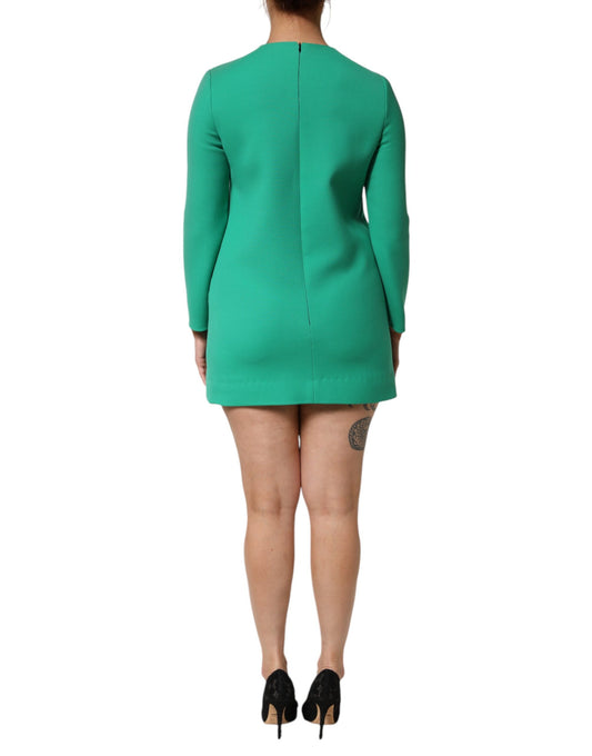 A green viscose acetate mini long sleeve dress with a fitted silhouette