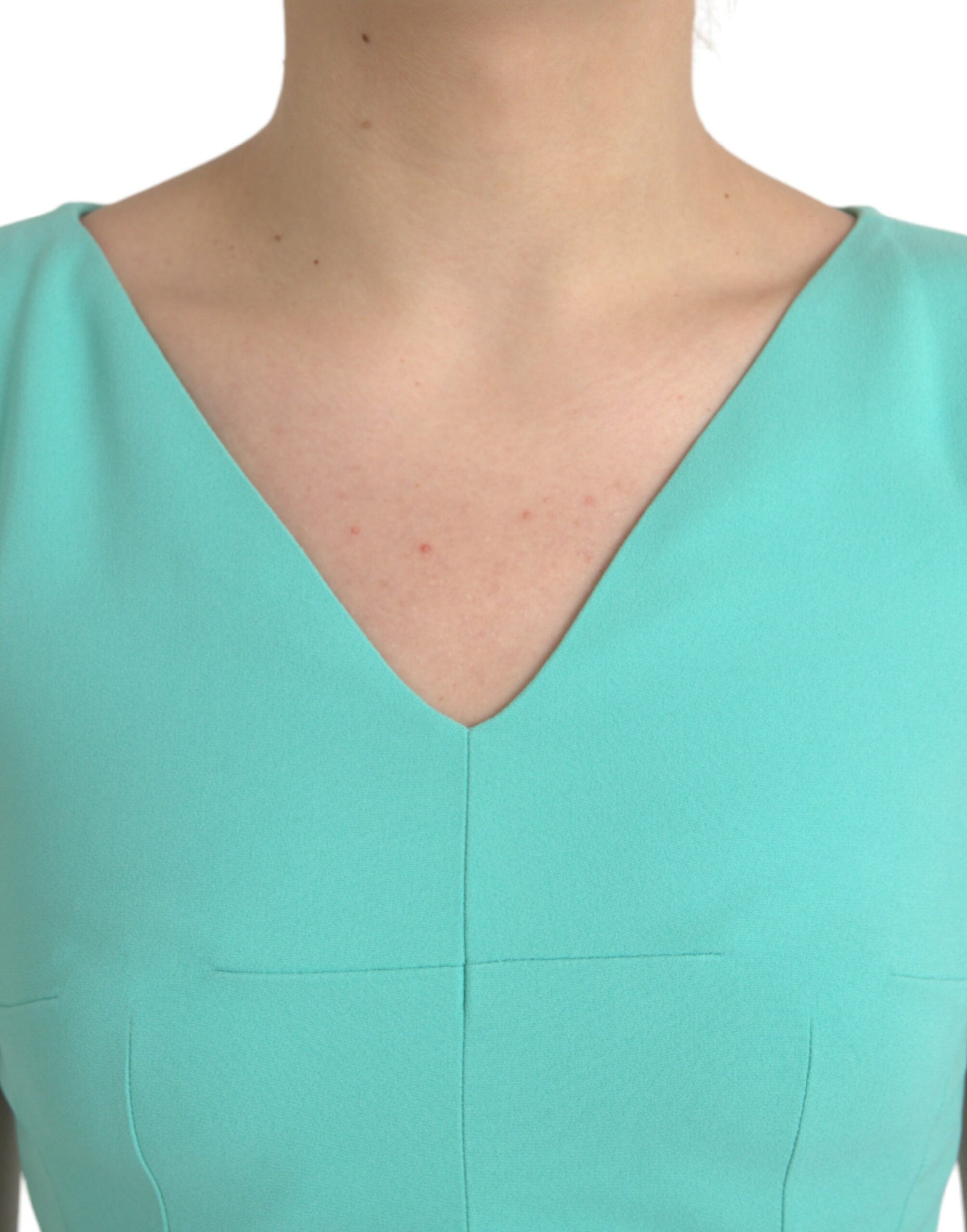 A sleeveless green midi dress with a V-neckline
