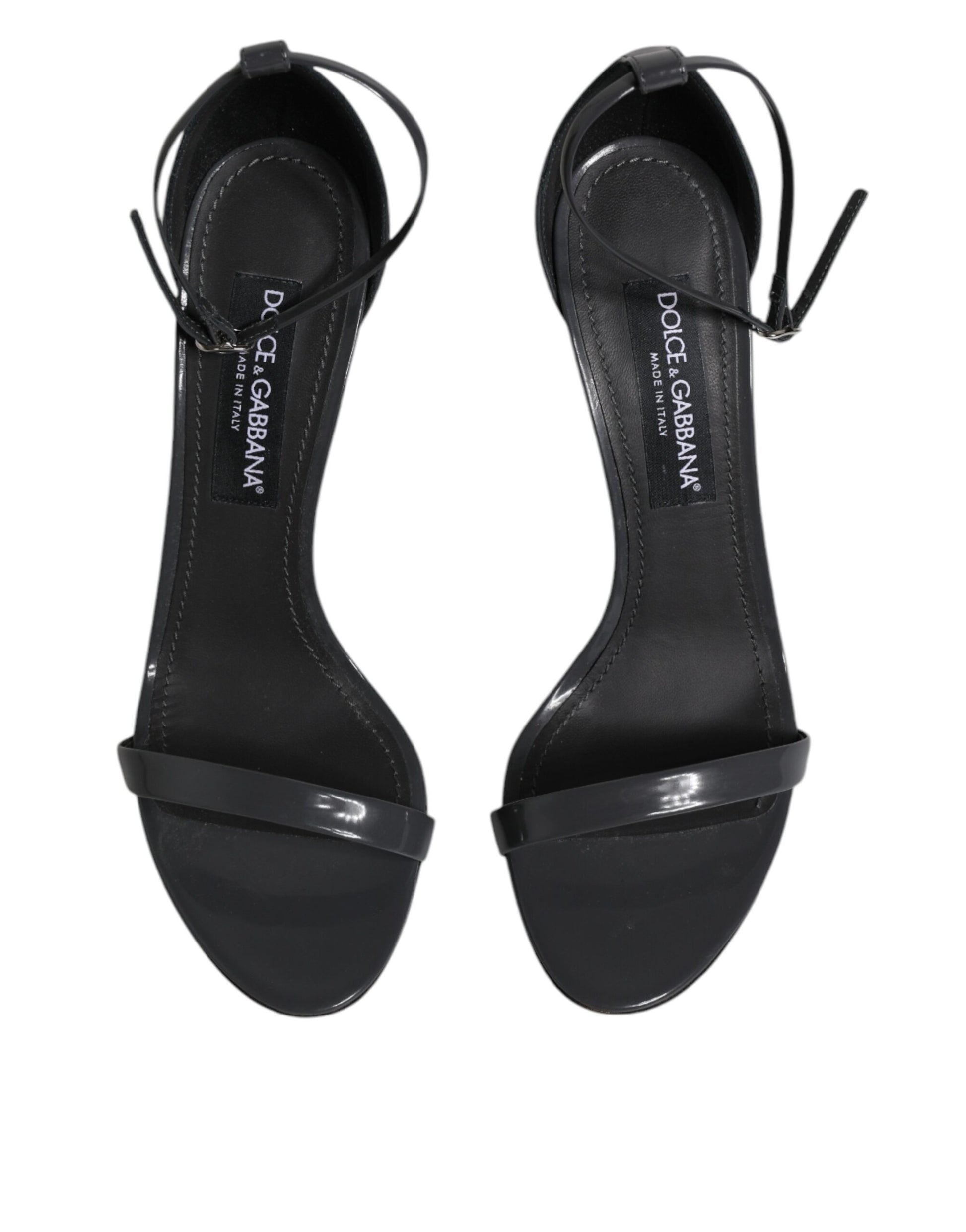 Pair of black high heel shoes with strap detailing