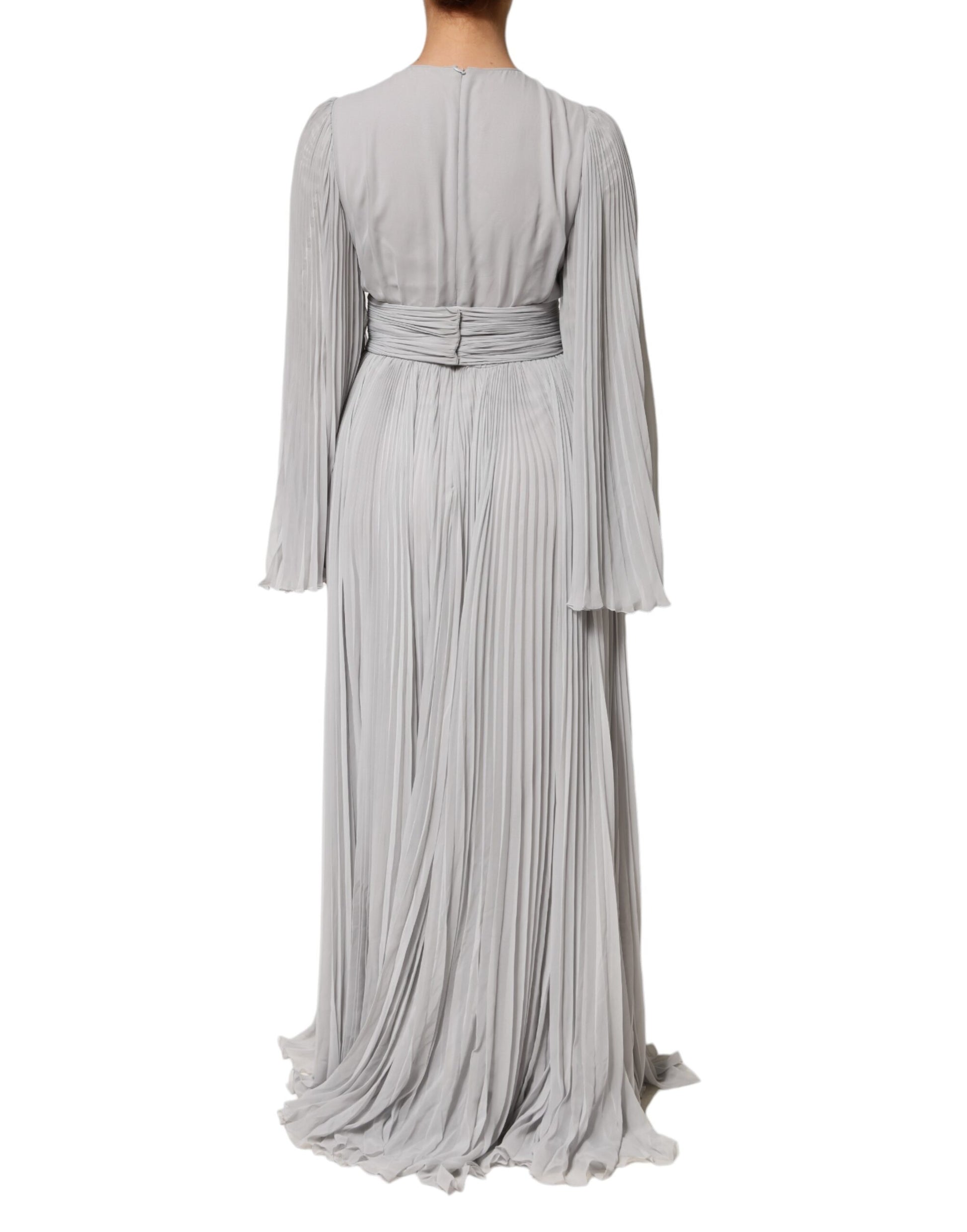 A long, grey pleated maxi dress with long sleeves and a silky blend fabric