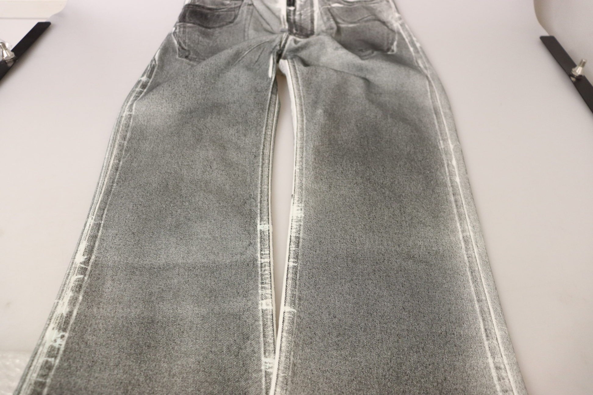 Pair of light blue jeans on display