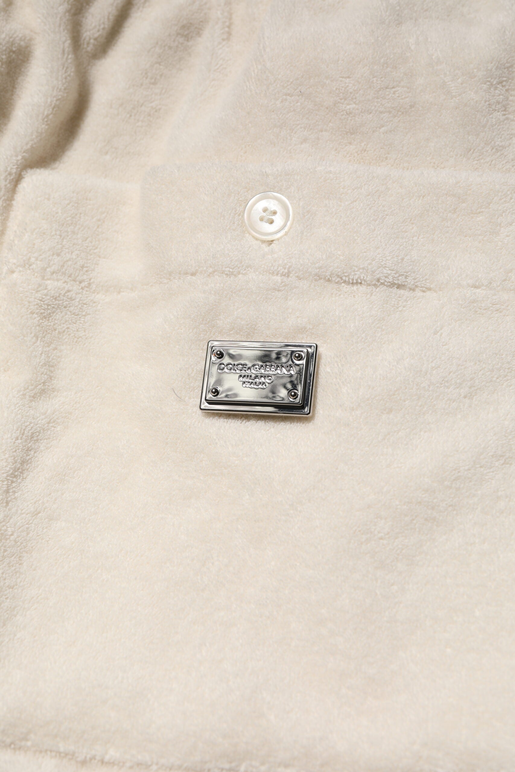 Small metal pin on fabric