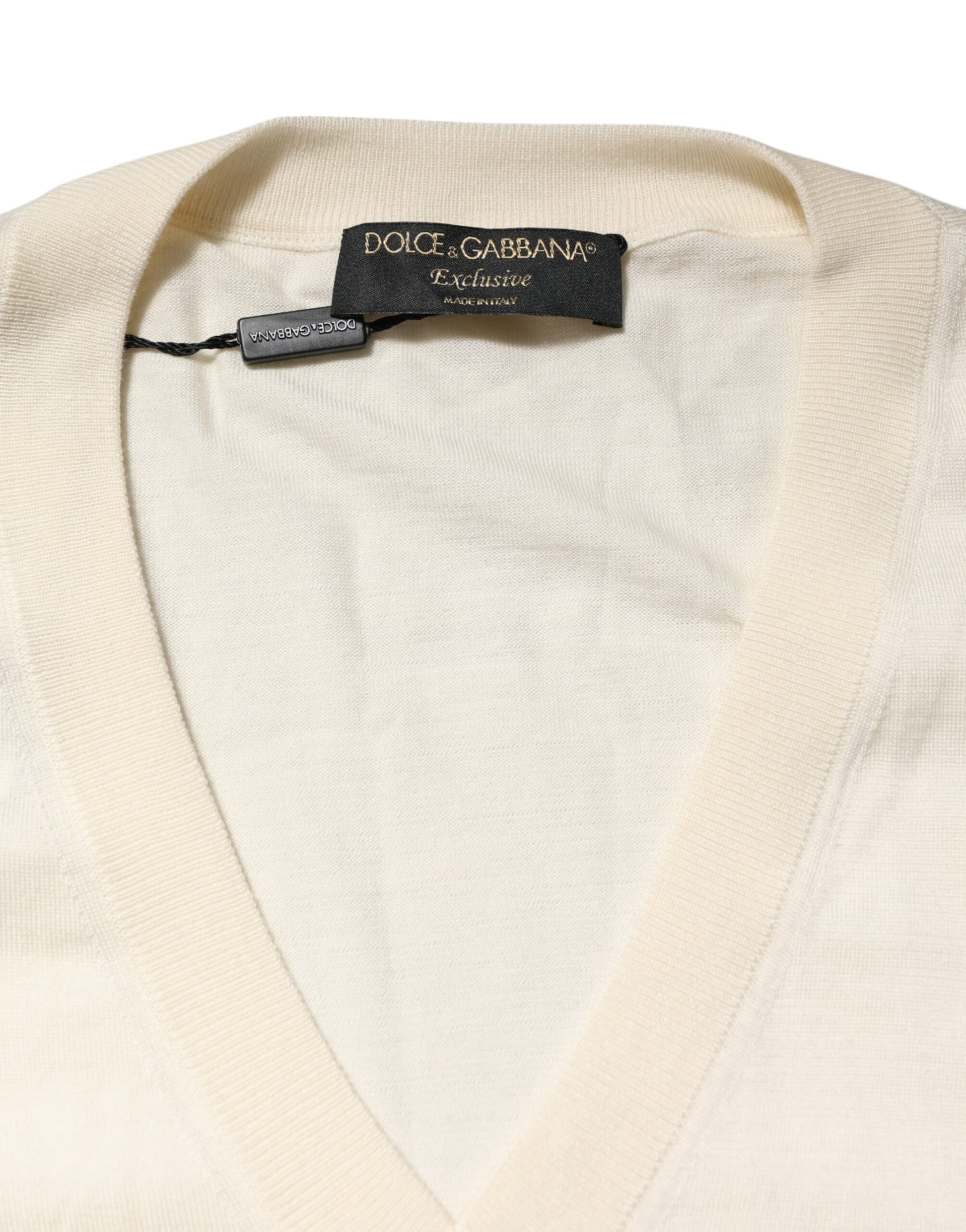 Tan knit sweater on hanger